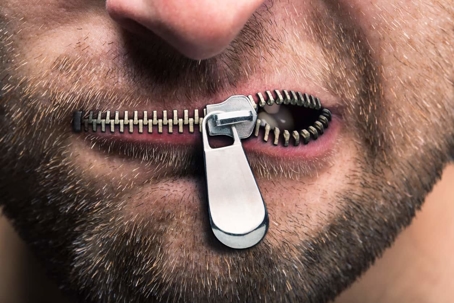 Man with zipper for mouth