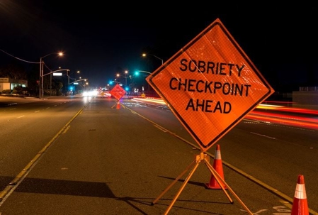 Sobriety checkpoint ahead sign
