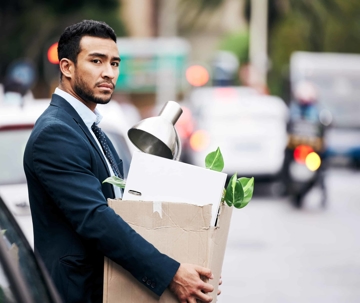 Man holding items in box